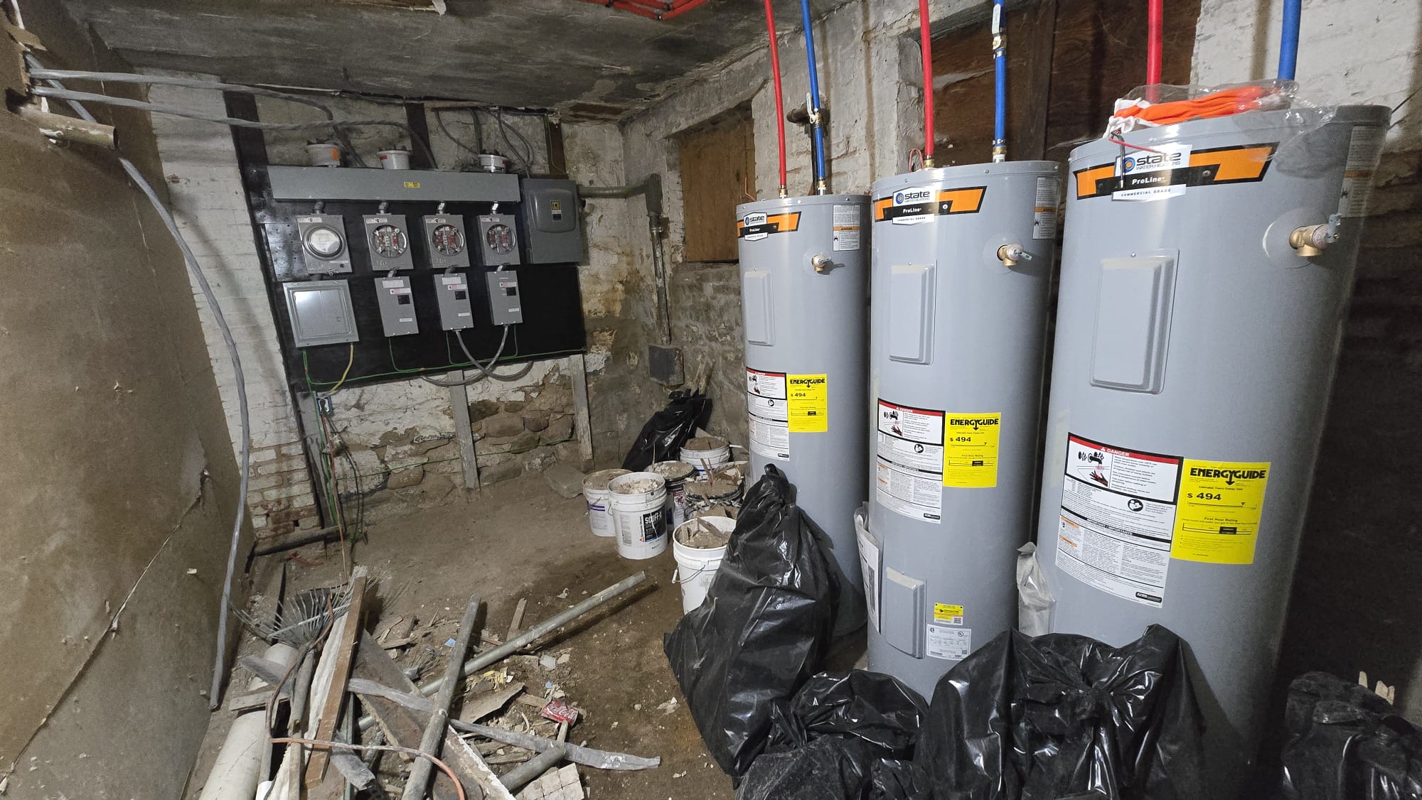 Three Water Heaters & Electrical Meters — Basement